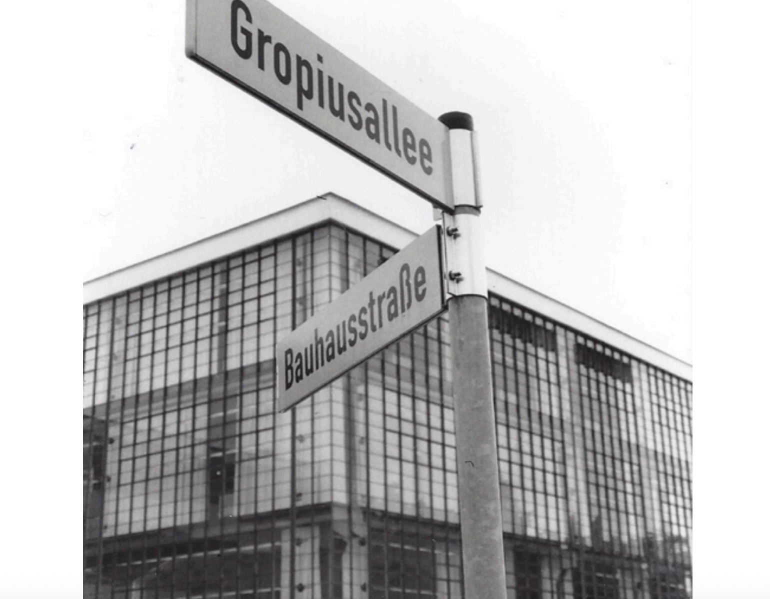 Black and white Bauhaus street sign and building.